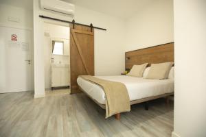 Cama ou camas em um quarto em Alojamientos Cantíber