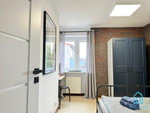 Posteľ alebo postele v izbe v ubytovaní Bałtyk Apartment- Tranquil Retreat, 15 Minutes to the Sea & Gdańsk City Center