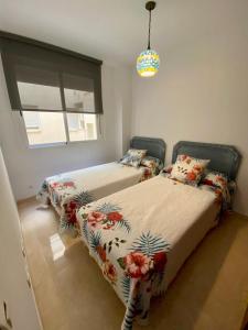 En eller flere senge i et værelse på Estepona Centro ¡Excelente ubicación!