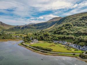 an aerial view of a village next to a river at Caladh Beag in Lochranza