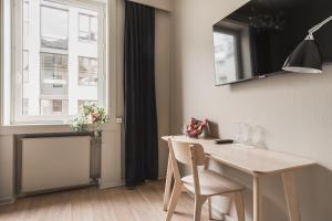 TV a/nebo společenská místnost v ubytování Heimen Hotel