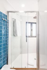 a bathroom with a shower with a glass door at Terrace Douro in Vila Nova de Gaia