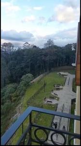 a view of a road with a mountain in the distance at Buona Vitta Resort & Spa in Gramado