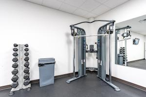a gym with treadmills and weights at Plantation East III in Gulf Shores