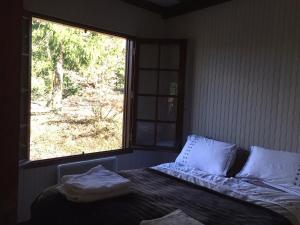 Ένα ή περισσότερα κρεβάτια σε δωμάτιο στο Le Chalet de la Loire