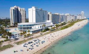 an aerial view of a beach in front of a city at 7th - 7 Heaven Miami - Stunning Ocean View - Free Parking in Miami Beach