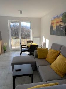 a living room with a couch and a table at Apartament Cieplice in Jelenia Góra