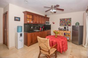 a kitchen with a table with a red table cloth at Lawson Rock - Yellowfish 110 Condo in Sandy Bay