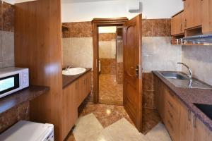 A kitchen or kitchenette at Penzión Víchrica