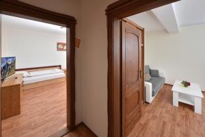 A bed or beds in a room at Penzión Víchrica