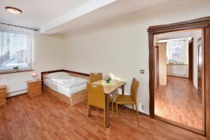 A bed or beds in a room at Penzión Víchrica
