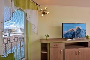 A television and/or entertainment centre at Penzión Víchrica