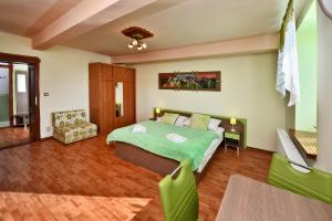 A bed or beds in a room at Penzión Víchrica