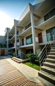 a building with stairs in front of it at El Hueco Villas in Lobitos