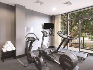 a gym with two exercise bikes and a window at Adina Apartment Hotel Sydney Airport in Sydney