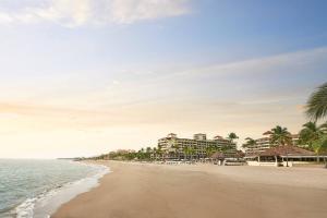 a view of a beach with a hotel and the ocean at Marriott Puerto Vallarta Resort & Spa in Puerto Vallarta