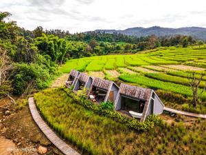 an image of a train track in a field at AomlongHomenon(อมลอง โฮมนอน) in Ban Bong