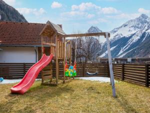 a playground with a slide and a slideintend at Beautiful Apartment in L ngenfeld with Terrace in Längenfeld