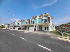 a large building on the side of a road at Luxury 2-Storey Terrace House near IOI City Mall Putrajaya in Putrajaya