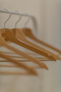 a wooden hanger hanging on a wall at Exclusive Csengery Residence in the heart of Budapest in Budapest