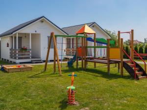 a playground in the yard of a house at One-storey holiday houses near the beach, G ski in Gąski
