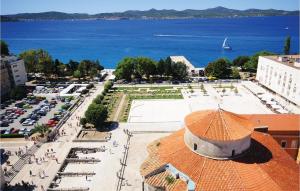 an aerial view of a city with a parking lot at Beautiful Apartment In Zadar With Kitchen in Zadar