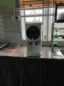 a machine sitting on top of a kitchen counter at D'Rhu Homestay with 2 aircond in Bachok
