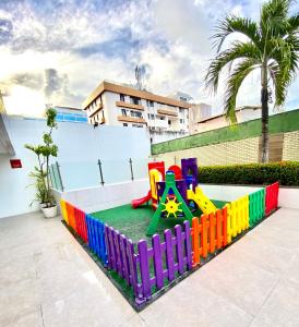 a childrens playground with a colorful play equipment at Beira Mar Imperial Flat 612 in João Pessoa
