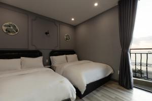 Cama o camas de una habitación en Mercury Beach DaNang