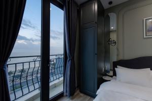 Cama o camas de una habitación en Mercury Beach DaNang