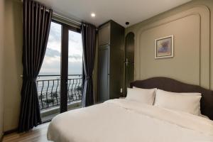 Cama o camas de una habitación en Mercury Beach DaNang