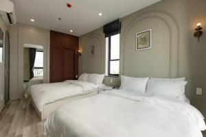 Cama o camas de una habitación en Mercury Beach DaNang