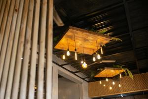 a chandelier hanging from the ceiling of a restaurant at HappyNest Hostel Cebu in Cebu City