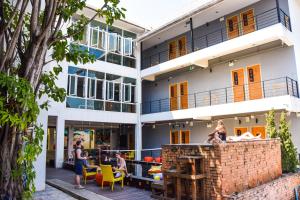 a group of people standing outside of a building at Mad Monkey Chiang Mai in Chiang Mai