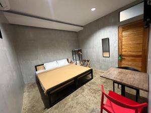 Voodi või voodid majutusasutuse HappyNest Hostel Cebu toas