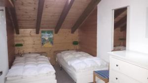 Postel nebo postele na pokoji v ubytování La Collina Haus C Niedergrächen