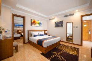 Postelja oz. postelje v sobi nastanitve BlueSun Danang Beach Hotel