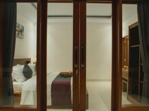 Postel nebo postele na pokoji v ubytování Pandu guest house