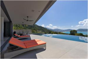 an image of a house with a swimming pool at The Cube Ocean View Pool Villa Kalim in Patong Beach