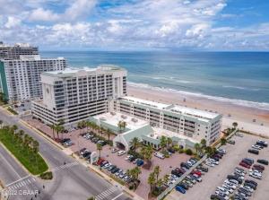 an aerial view of a hotel and the beach at Beautiful one bedroom oceanfront condo in Daytona Beach