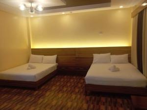 Krevet ili kreveti u jedinici u okviru objekta Dolores Resort Hotel