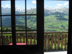 a view from a window of a mountain view at Aparthaus Surselva, Obersaxen Surcuolm, direkt an der Skipiste in Surcuolm