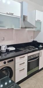 Kuchyň nebo kuchyňský kout v ubytování Joli appartement Mohammédia + 9 fotografií