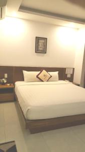 Cama o camas de una habitación en Majestic Star Hotel
