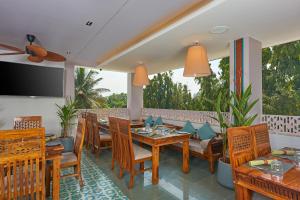 a dining room with a table and chairs at Southern Star,Bangalore in Bangalore