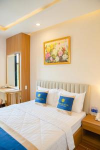 Kama o mga kama sa kuwarto sa SUNRISE Hotel Bạc Liêu