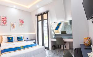Kama o mga kama sa kuwarto sa SUNRISE Hotel Bạc Liêu