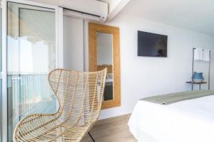 A bed or beds in a room at Sugar Beach Boutique Studio