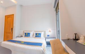 Kama o mga kama sa kuwarto sa SUNRISE Hotel Bạc Liêu