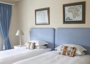 Postel nebo postele na pokoji v ubytování Hillwatering Country House